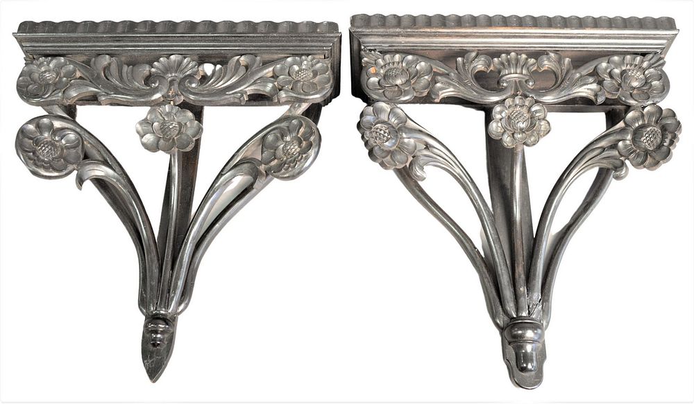 Appraisal: Pair of Ebonized Carved Wood Wall Brackets having floral design