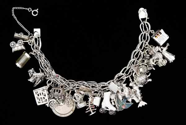 Appraisal: Sterling Silver Charm Bracelet A sterling silver charm bracelet with