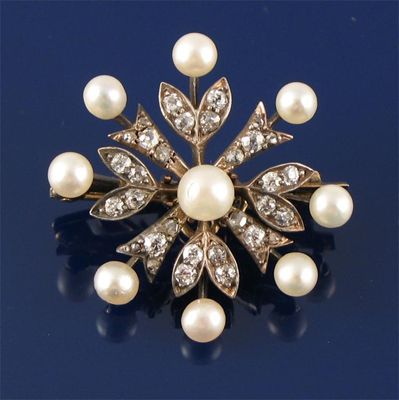 Appraisal: A Victorian diamond and pearl set floral brooch Detachable brooch