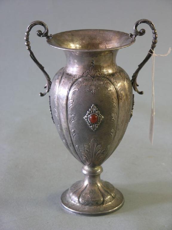 Appraisal: A German silver vase pedestal form with twin handles bulbous