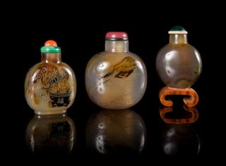 Appraisal: Three Carved Agate Snuff Bottles Three Carved Agate Snuff Bottles