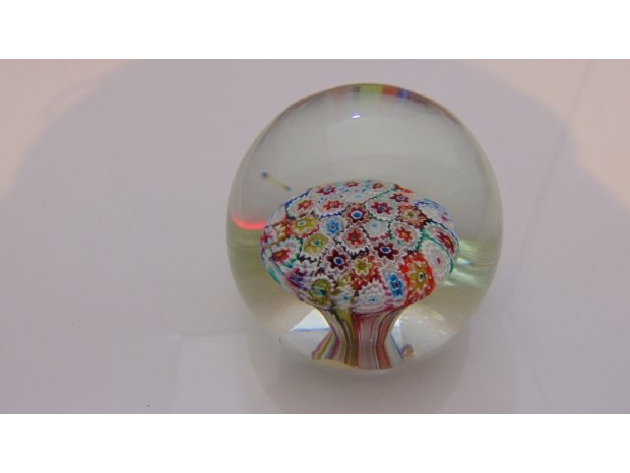 Appraisal: An Italian Milliefiori paperweight with internal mushroom shaped bed of