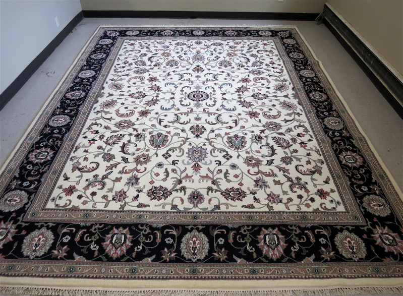 Appraisal: HAND KNOTTED ORIENTAL CARPET Indo-Persian overall floral Isfahan design on