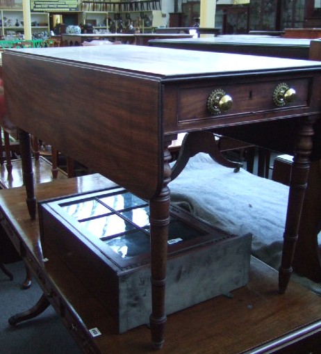 Appraisal: A Victorian mahogany Pembroke table with two frieze drawers raised