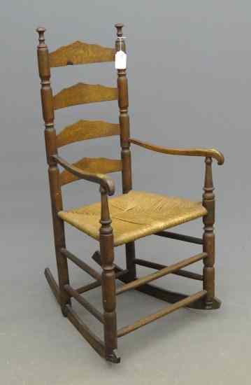 Appraisal: th c ladderback armed rocker '' Seat Ht '' Overall