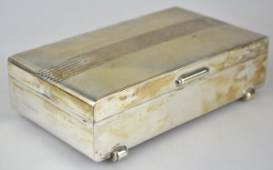 Appraisal: An Art Deco style silver cigarette box with engine turned