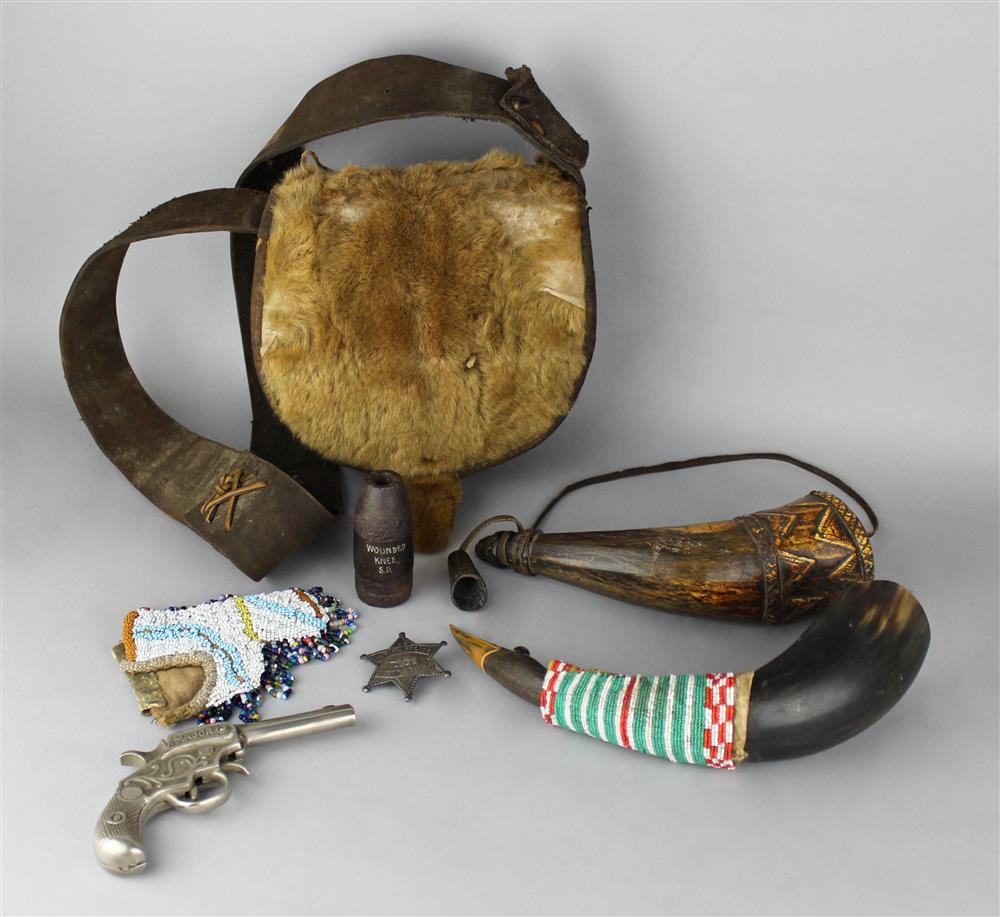 Appraisal: LEATHER AND FUR CARRYING POUCH CARVED WOOD POWDER HORN TOY