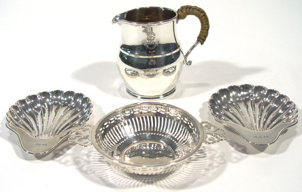 Appraisal: Silver cream jug with wicker handle London a silver two