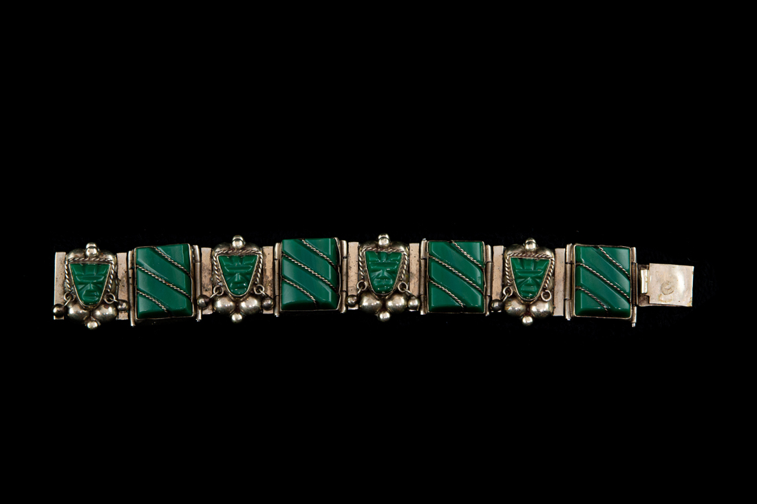 Appraisal: A MEXICAN STERLING LINK BRACELET WITH AZTEC STYLE GREEN STONE