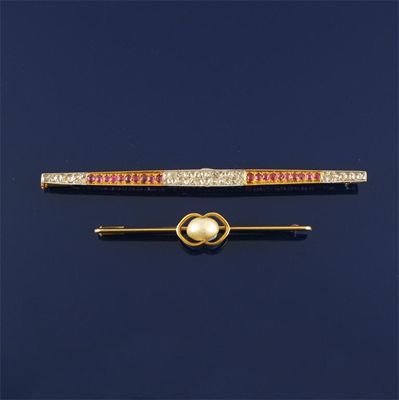 Appraisal: A diamond and ruby set two colour gold bar brooch