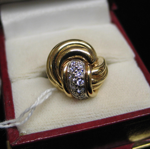 Appraisal: DIAMOND AND FOURTEEN KARAT GOLD RING set with round-cut diamonds