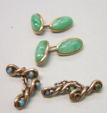 Appraisal: A pair of gold mounted oval jade set cufflinks and