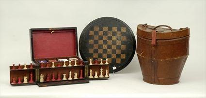 Appraisal: English Figured Walnut Games Box Containing stained bone chess pieces