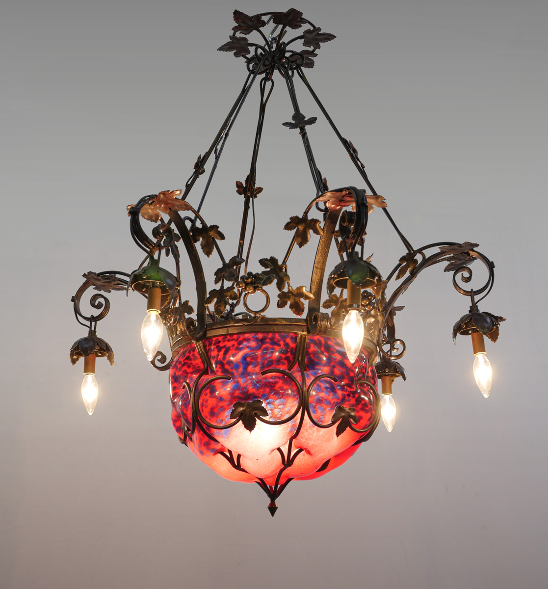 Appraisal: FRENCH IRON CHANDELIER WITH BLOWN GLASS SHADE Overall scrolling grapevine