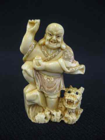 Appraisal: Carved Ivory Netsuke immortal foo dog signed ''