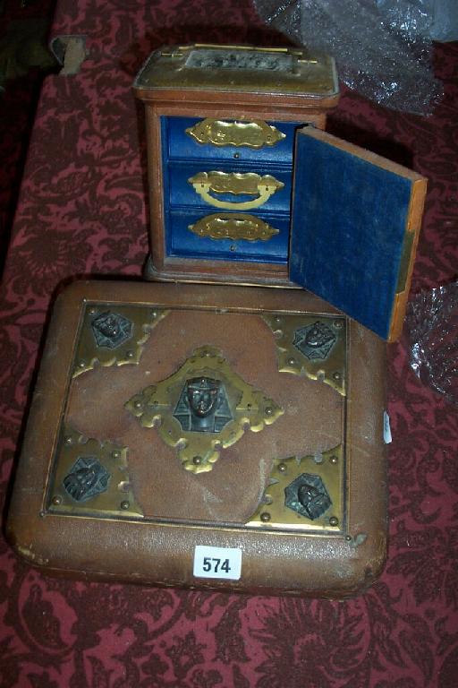 Appraisal: A late th century leather and brass mounted miniature safe