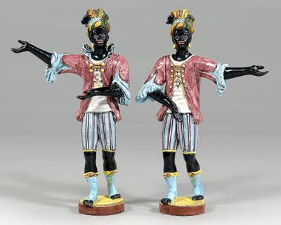 Appraisal: Pair majolica blackamoors each with outstretched arms red coats above