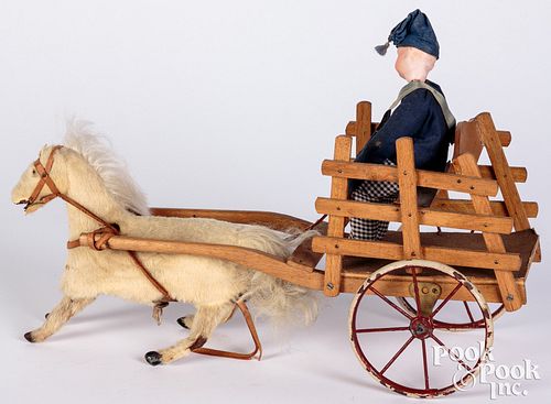 Appraisal: BISQUE HEAD FIGURE IN CART WITH WIND-UP HORSEBisque head figure