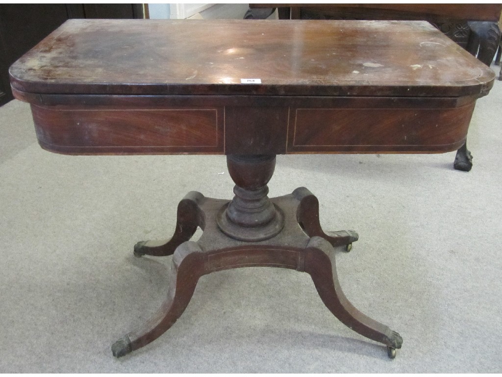 Appraisal: Victorian mahogany inlaid turnover games table