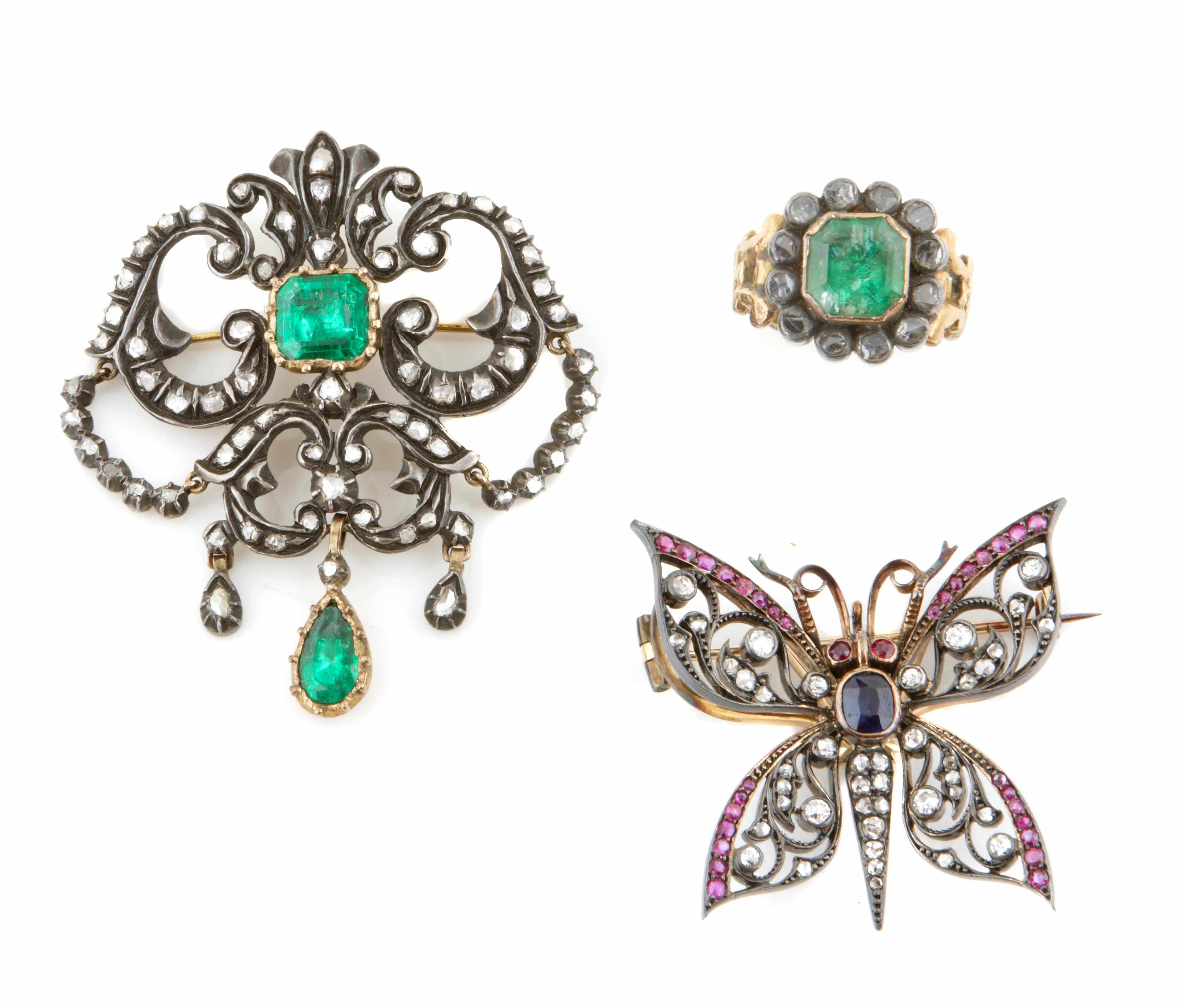 Appraisal: A collection of three gem-set silver and gold brooches and