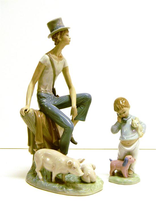 Appraisal: Two Lladro figurines boy in top hat shepherding two pigs