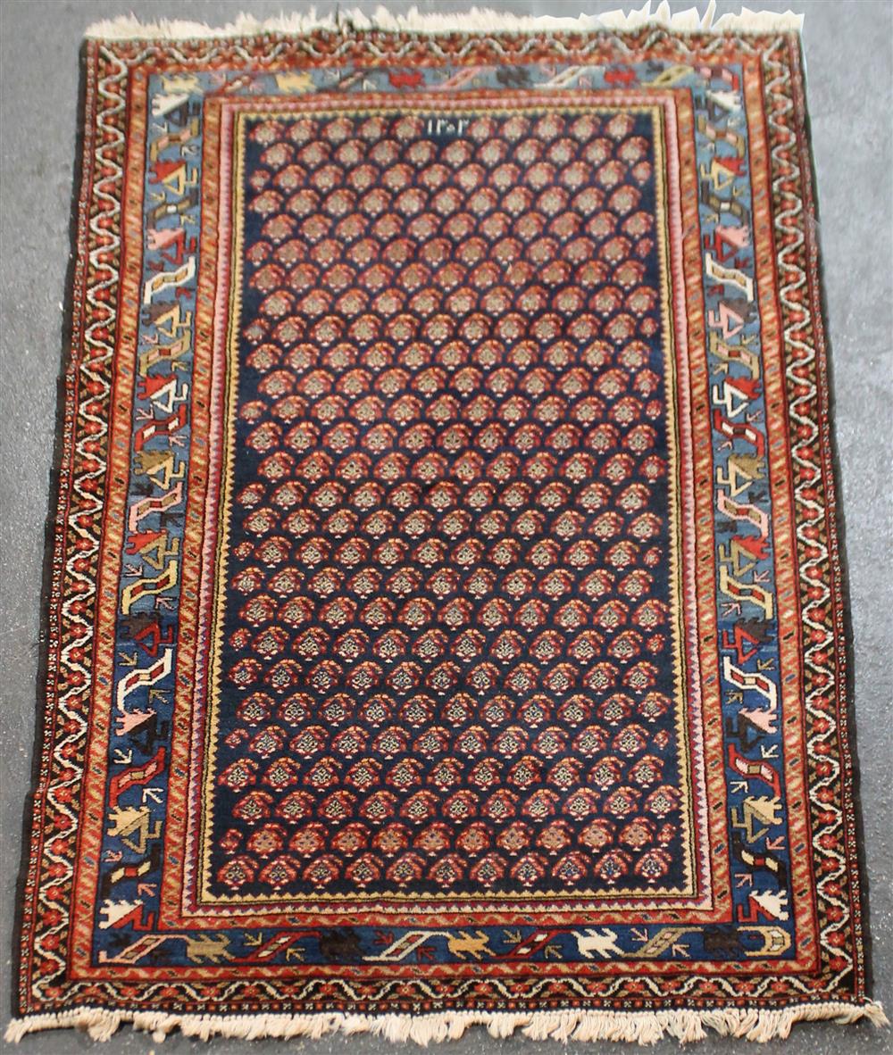 Appraisal: ORIENTAL WOOL RUG WITH BOTEH DESIGN having a field with