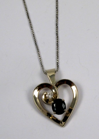 Appraisal: SAPPHIRE AND DIAMOND PENDANT NECKLACE the heart shaped pendant suspended