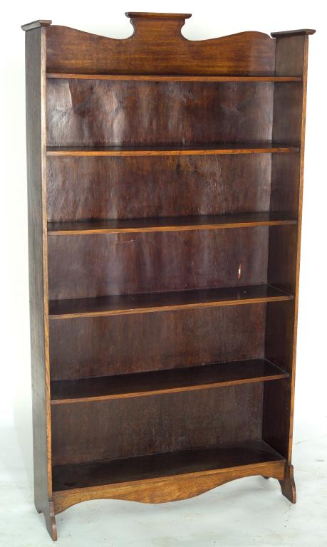 Appraisal: ARTS AND CRAFTS OAK OPEN BOOKCASE c the shaped crest