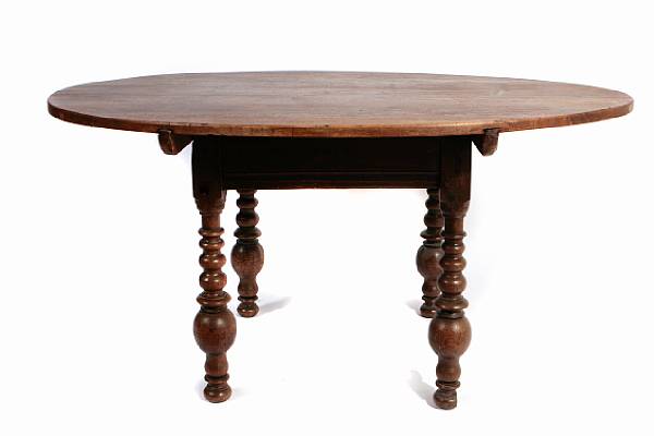 Appraisal: A Flemish Baroque style mixed wood dining table height in