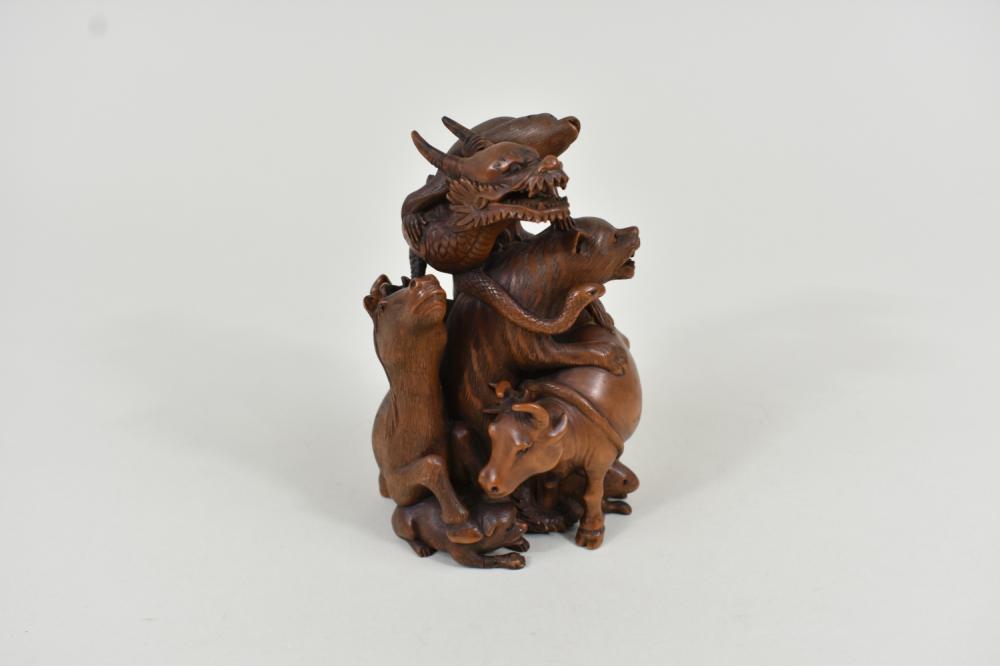 Appraisal: JAPANESE CARVED WOOD ASTROLOGICAL ANIMAL GROUPEarly th Century The undersigned