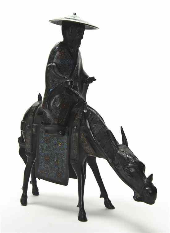 Appraisal: A Bronze Model of a Figure on a Donkey having