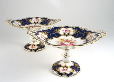 Appraisal: A pair of Coalport tazzae each painted with colourful flowers