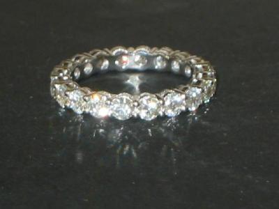 Appraisal: A DIAMOND FULL HOOP ETERNITY RING the brilliant cut diamonds