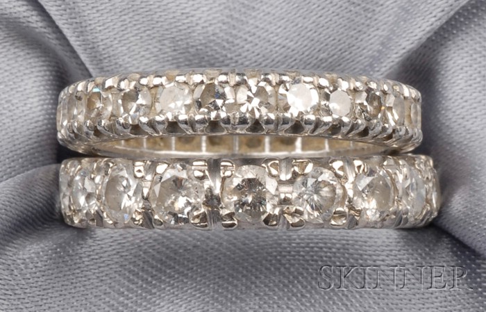 Appraisal: Two Diamond Eternity Bands one set with eighteen full-cut diamonds