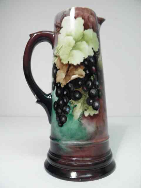 Appraisal: Early th century hand painted pitcher vase with a grape