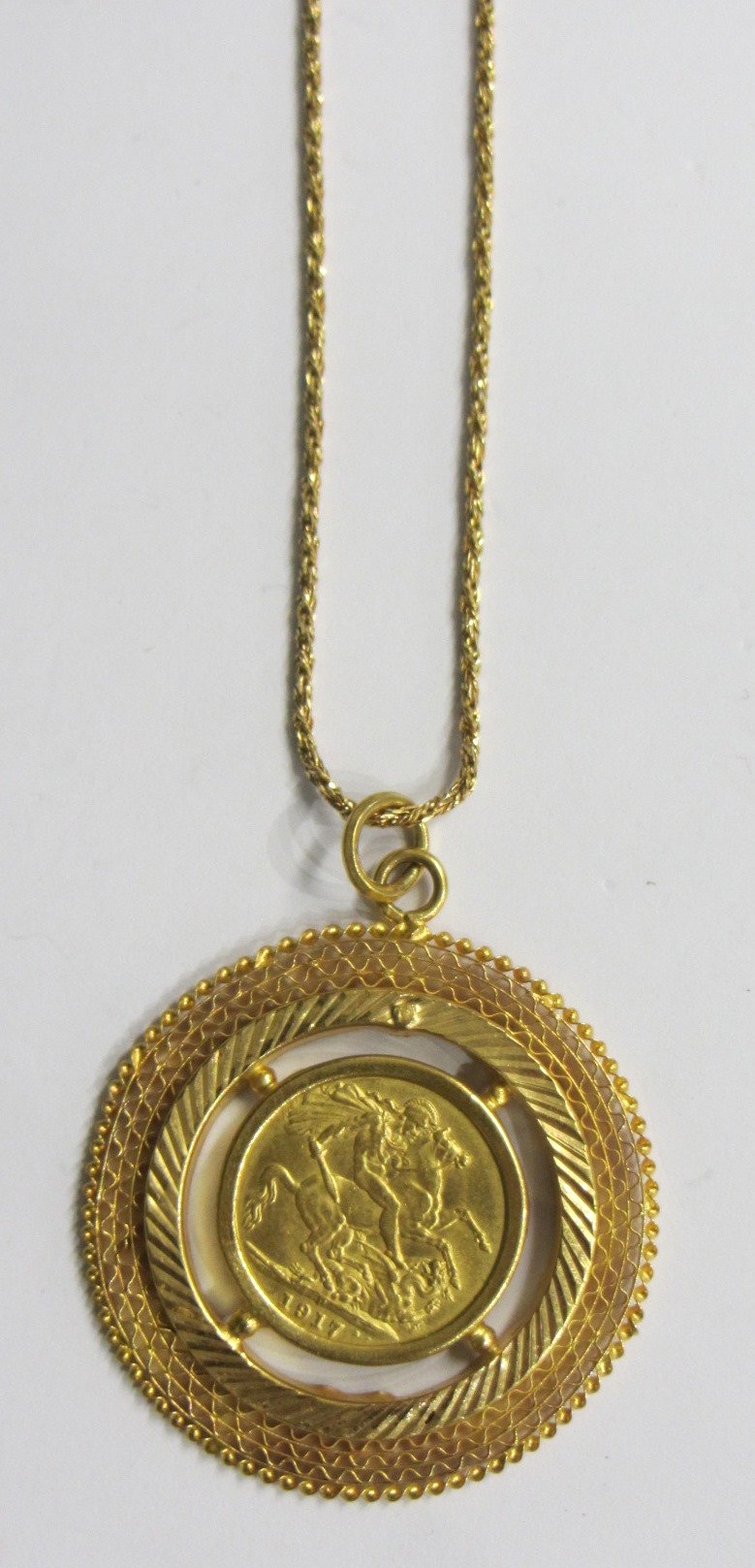 Appraisal: A Middle Eastern circular pendant mounted with a jeweller's copy