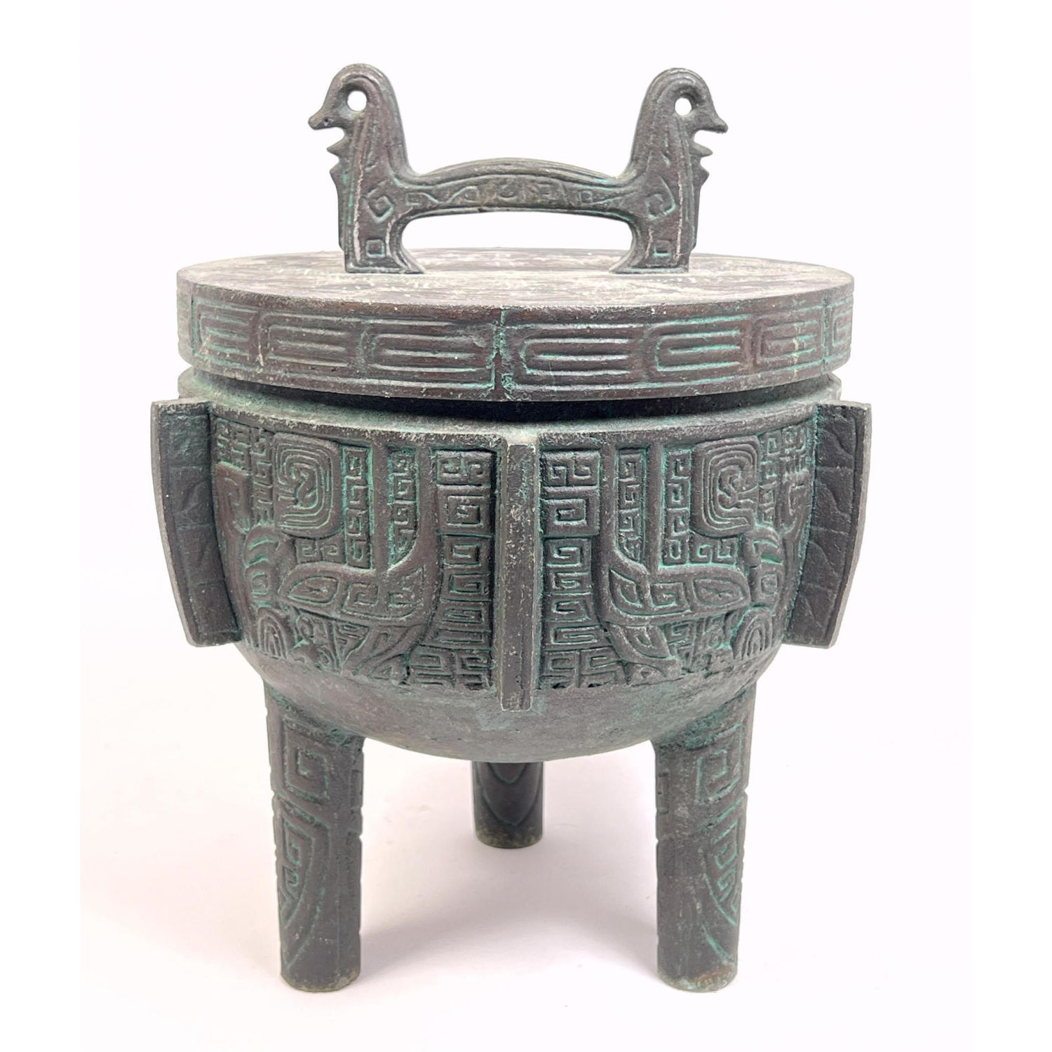 Appraisal: Tribal Relief Design Ice Bucket Three legs Figural handle Lined