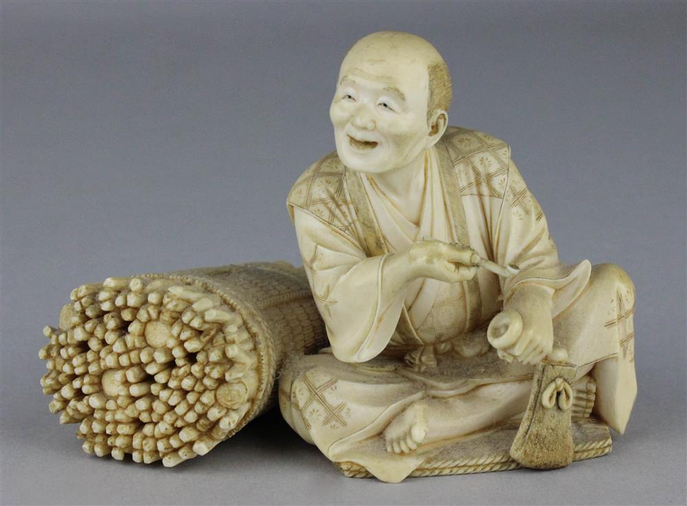 Appraisal: JAPANESE IVORY FIGURE OF A SEATED PIPE SMOKER TH C