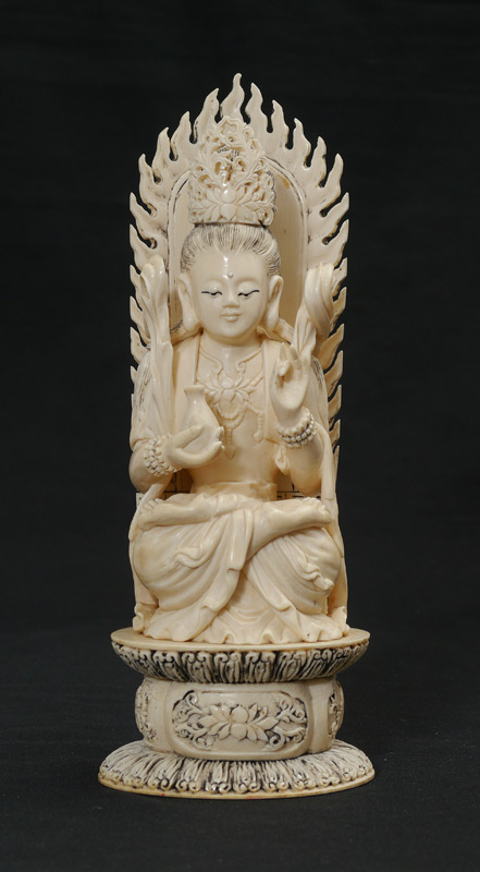 Appraisal: CARVED IVORY GUANYIN GODDESS OF COMPASSION Seated woman on throne