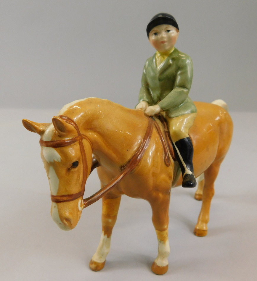 Appraisal: A Beswick model of a boy on a pony model