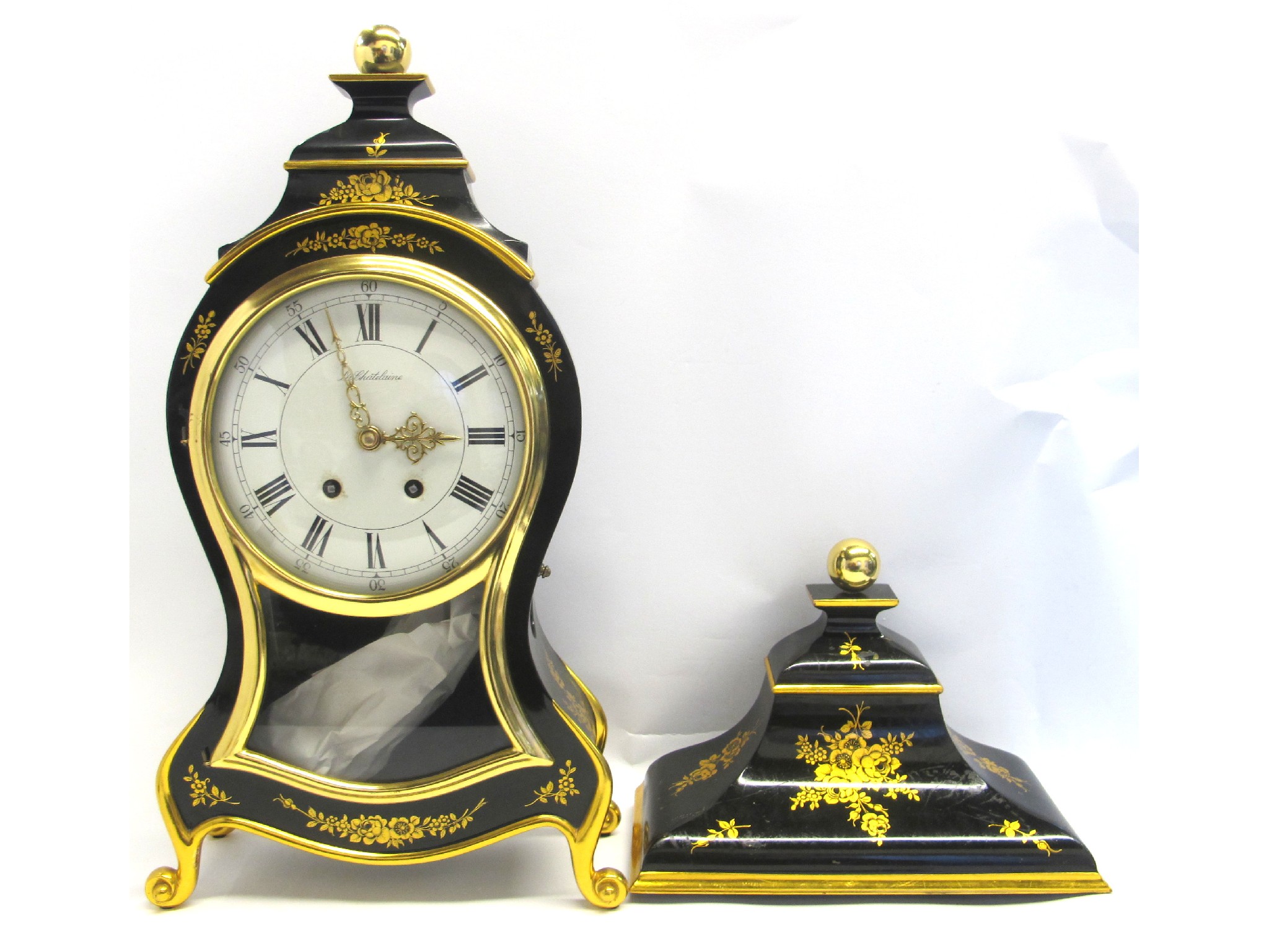 Appraisal: A French gilt ebonised mantle clock with wall shelf