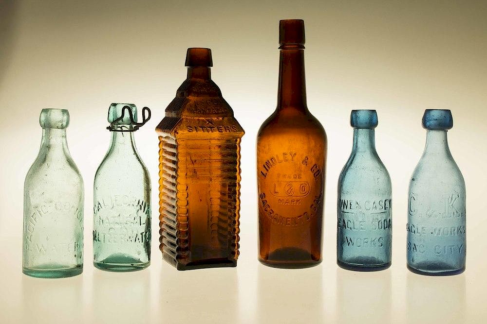 Appraisal: Six Western Bottles Six assorted Western glass bottles comprising a