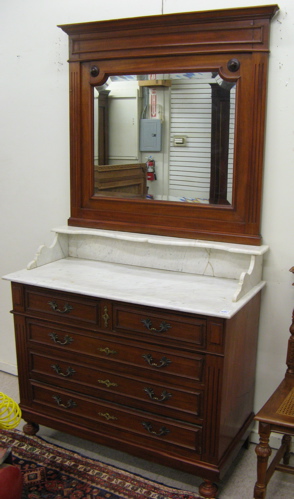 Appraisal: VICTORIAN MARBLE-TOP DRESSER WITH MIRROR Continental c The five-drawer mahogany