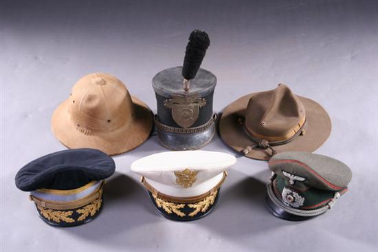 Appraisal: MILITARY HEADGEAR Including pith helmet USMA Cadet's parade hat felt