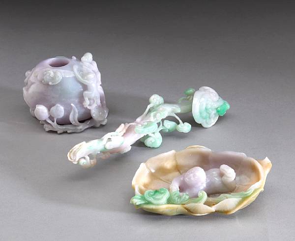 Appraisal: Three small jadeite carvings The first a peach shaped water