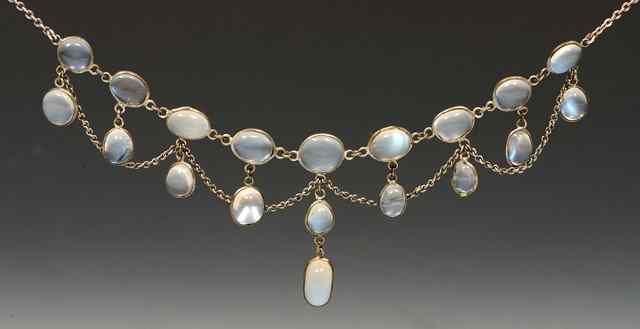 Appraisal: A SILVER AND MOONSTONE NECKLACE with moonstone droplets