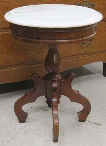 Appraisal: VICTORIAN STYLE ARMCHAIR AND SIDE TABLE the chair with carved