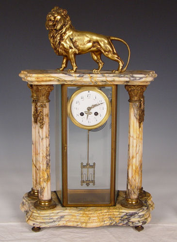 Appraisal: FRENCH CRYSTAL REGULATOR CLOCK WITH BRONZED LION Marble base columns