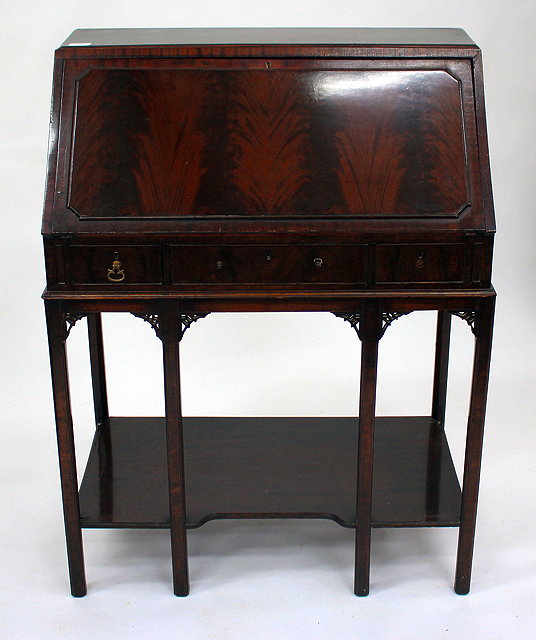 Appraisal: AN EDWARDIAN MAHOGANY BUREAU the panelled fall front opening to