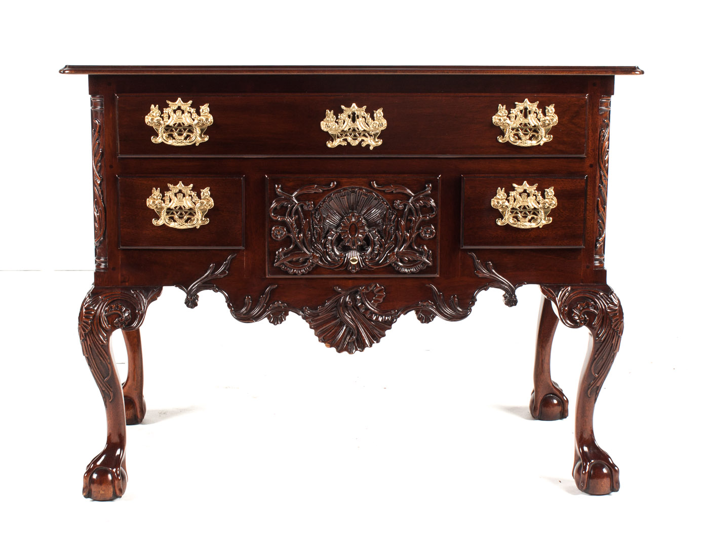 Appraisal: Kindel Chippendale style mahogany lowboy elaborate relief carving in the